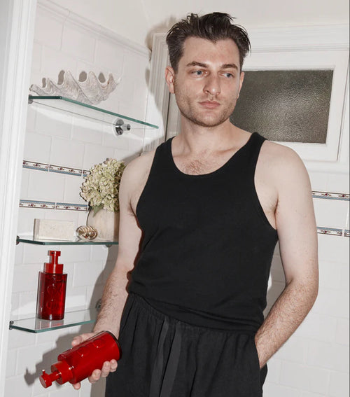 Portrait of Australian designer Corey Ashford in his Richmond home, featured in MECCA Kit, sharing his design philosophy, rituals and creative inspirations.